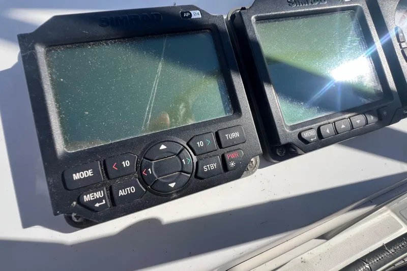 Adattare Yacht Photos Pics Simrad navigation displays on a 2012 Beneteau Oceanis 45 yacht, showing control buttons.
