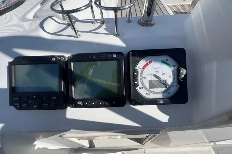 Adattare Yacht Photos Pics Beneteau Oceanis 45 2012 yacht instruments, including Simrad displays and wind gauge.