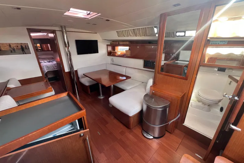 Adattare Yacht Photos Pics Interior of 2012 Beneteau Oceanis 45 yacht with modern furnishings and wood finish.