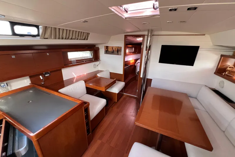Adattare Yacht Photos Pics Luxurious interior of 2012 Beneteau Oceanis 45 yacht with elegant wood finish.