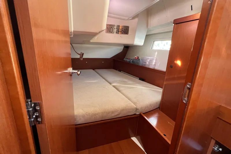 Adattare Yacht Photos Pics Cozy cabin interior of 2012 Beneteau Oceanis 45 sailboat with wooden finish.