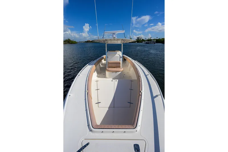  Yacht Photos Pics 2005 Venture 34 Center Console boat on calm water under a clear blue sky.