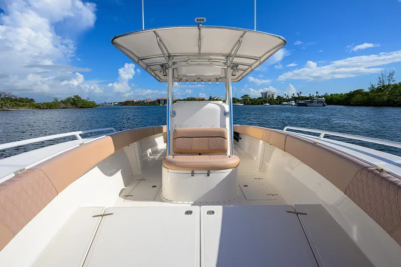  Yacht Photos Pics 2005 Venture 34 Center Console boat on calm water under a clear blue sky.