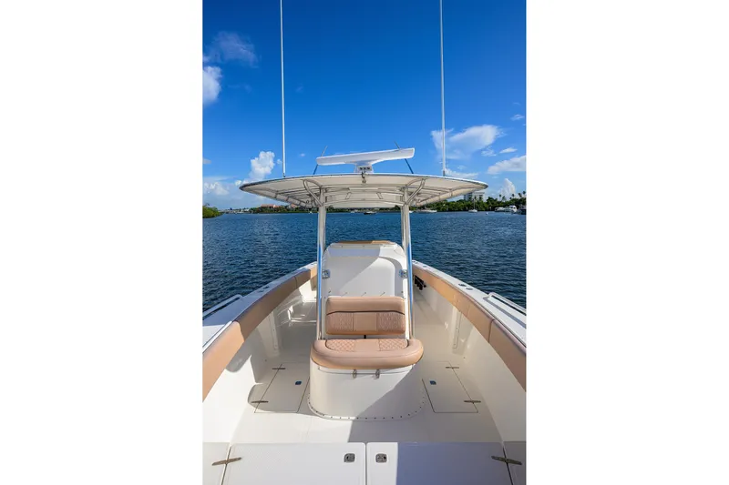  Yacht Photos Pics 2005 Venture 34 Center Console boat on calm water under clear blue sky.