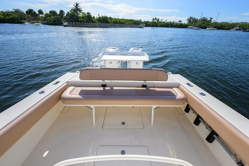  Yacht Photos Pics 2005 Venture 34 Center Console boat on calm water, featuring spacious seating and scenic view.
