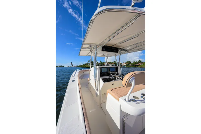  Yacht Photos Pics 2005 Venture 34 Center Console boat on water, featuring sleek design and modern controls.