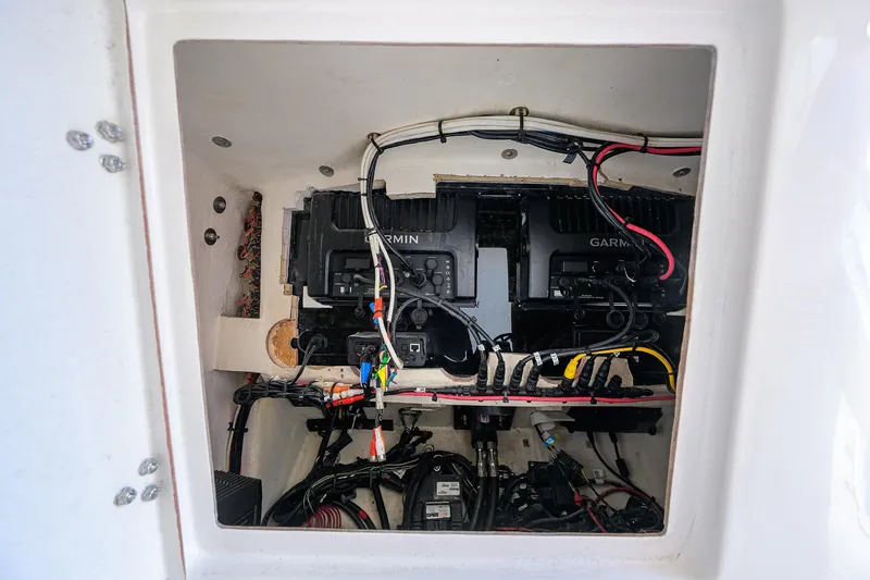  Yacht Photos Pics Electrical compartment of a 2005 Venture 34 Center Console with Garmin equipment and wiring.