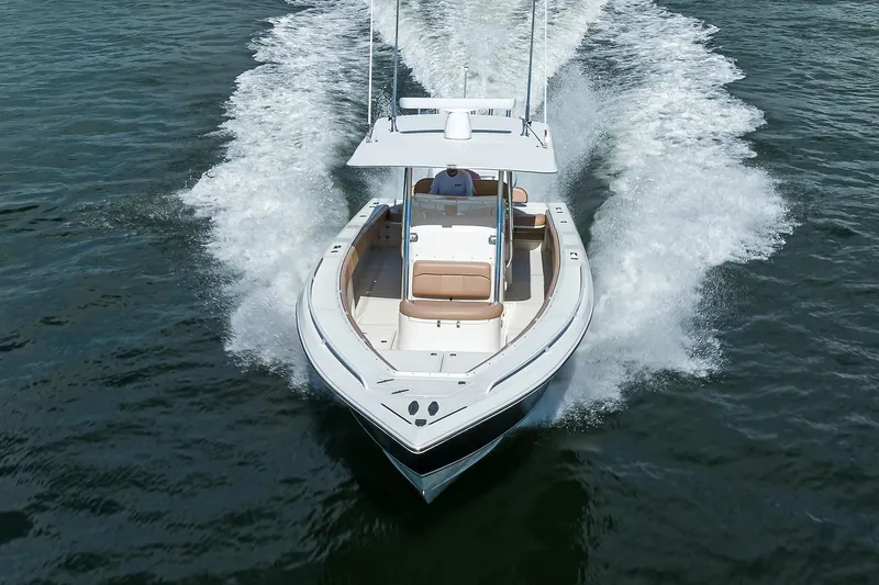  Yacht Photos Pics 2005 Venture 34 Center Console boat cruising on open water.