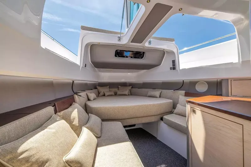  Yacht Photos Pics Luxurious interior of 2025 Axopar 45 XC Cross Cabin with plush seating and modern design.