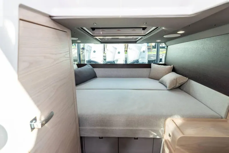  Yacht Photos Pics Luxurious interior cabin of 2025 Axopar 45 XC Cross Cabin with modern bedding.