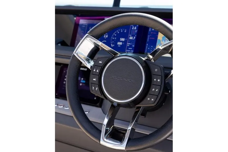  Yacht Photos Pics Steering wheel of 2025 Axopar 45 XC Cross Cabin with digital dashboard display.