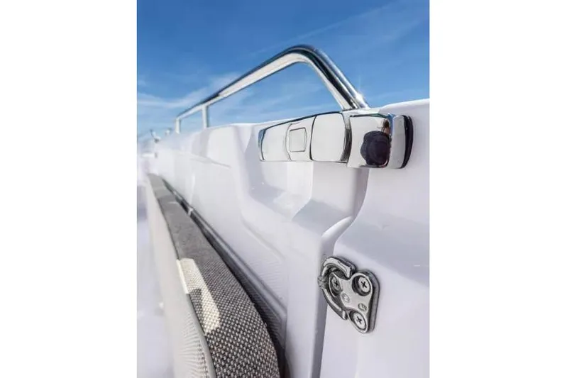  Yacht Photos Pics Close-up of 2025 Axopar 45 XC Cross Cabin's sleek chrome railing and textured surface.