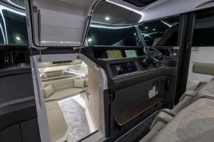  Yacht Photos Pics 2025 Axopar 45 XC Cross Cabin interior with modern cockpit and seating area.