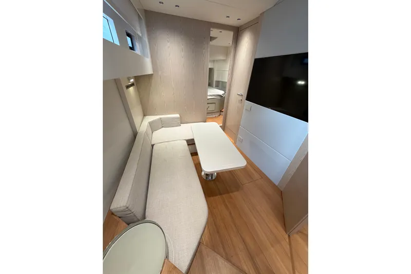 Kawa Yacht Photos Pics Interior of 2023 SACS Rebel 55 yacht with modern seating and sleek design.