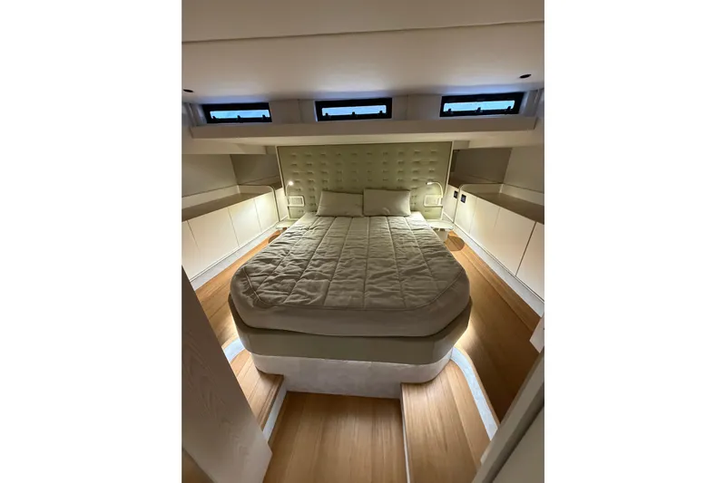 Kawa Yacht Photos Pics Luxurious bedroom interior of 2023 SACS Rebel 55 yacht with modern design.