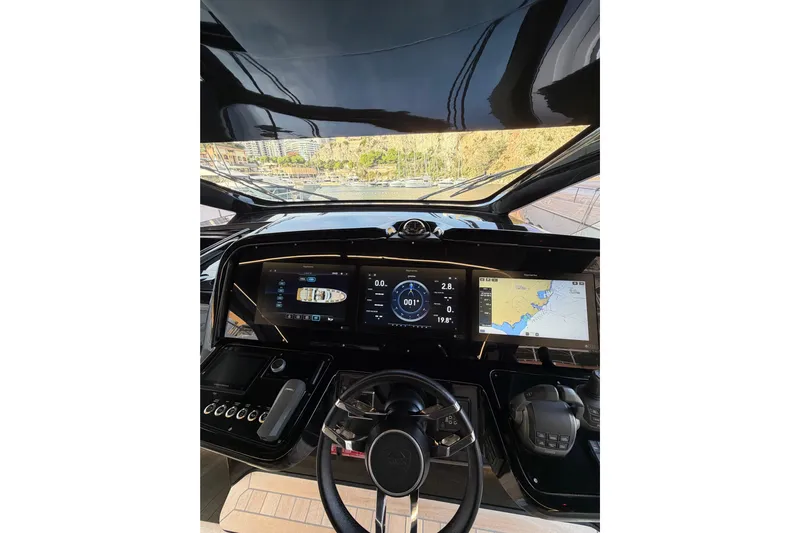 Kawa Yacht Photos Pics 2023 SACS Rebel 55 yacht dashboard with advanced navigation displays and controls.