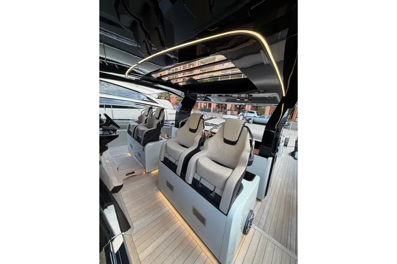 Kawa Yacht Photos Pics Luxurious interior of 2023 SACS Rebel 55 yacht with modern seating and sleek design.