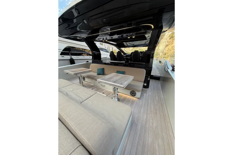 Kawa Yacht Photos Pics 2023 SACS Rebel 55 luxury yacht interior with seating and tables.