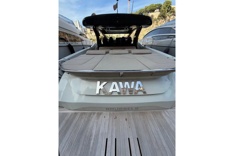Kawa Yacht Photos Pics 2023 SACS Rebel 55 luxury yacht docked, rear view with "KAWA" nameplate.