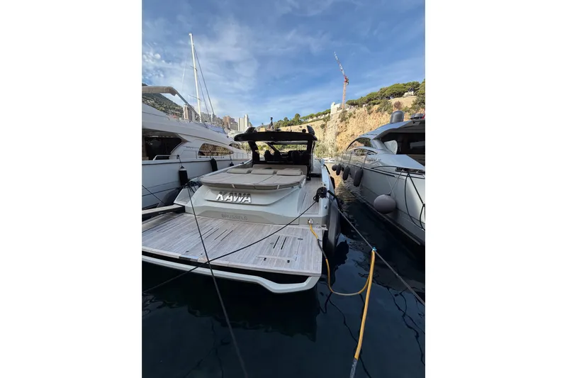 Kawa Yacht Photos Pics 2023 SACS Rebel 55 yacht docked in a scenic marina.