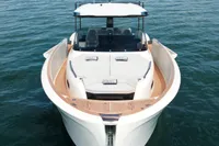 2022 Solaris Power 44 Open yacht on calm water, scenic coastal backdrop.