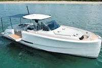 2022 Solaris Power 44 Open yacht on calm water, featuring sleek design and sunshade canopy.