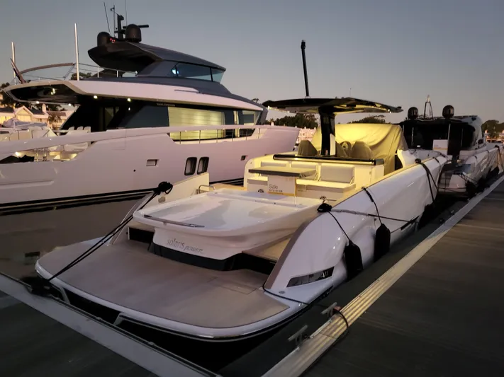  Yacht Photos Pics 2022 Solaris Power 44 Open yacht docked at sunset, showcasing sleek design and luxury features.