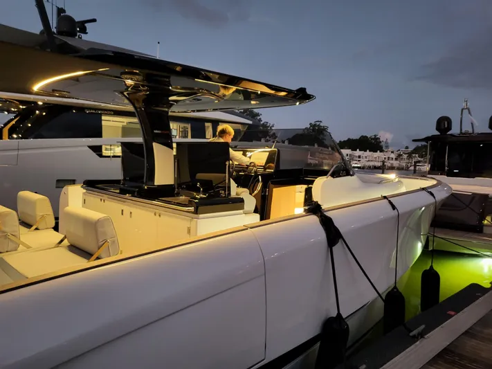  Yacht Photos Pics 2022 Solaris Power 44 Open yacht docked at sunset, featuring sleek design and modern amenities.