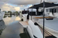 2022 Solaris Power 44 Open yacht docked at marina, showcasing sleek design and spacious deck.