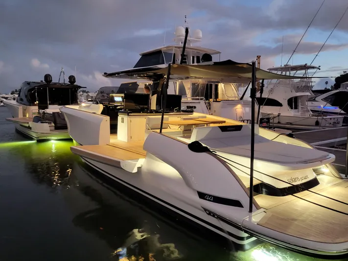  Yacht Photos Pics 2022 Solaris Power 44 Open yacht docked, illuminated at dusk with elegant design and ambient lighting.