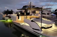 2022 Solaris Power 44 Open yacht docked, illuminated at dusk with elegant design and ambient lighting.