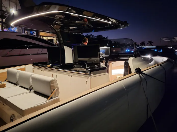  Yacht Photos Pics 2022 Solaris Power 44 Open yacht illuminated at night, showcasing sleek design and modern features.