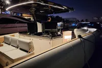 2022 Solaris Power 44 Open yacht illuminated at night, showcasing sleek design and modern features.