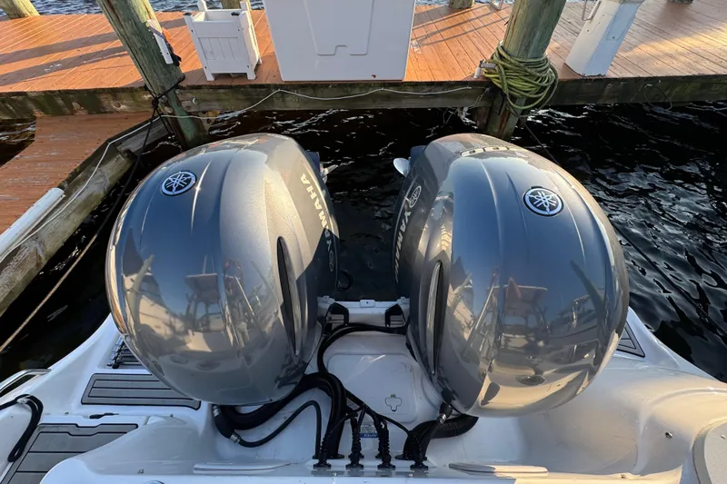 Yacht Photos Pics Twin Yamaha outboard engines on a 2023 Sea Fox 268 Traveler boat at a dock.