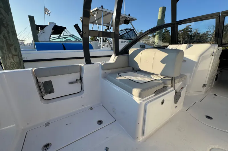  Yacht Photos Pics 2023 Sea Fox 268 Traveler boat interior with seating and storage compartments.