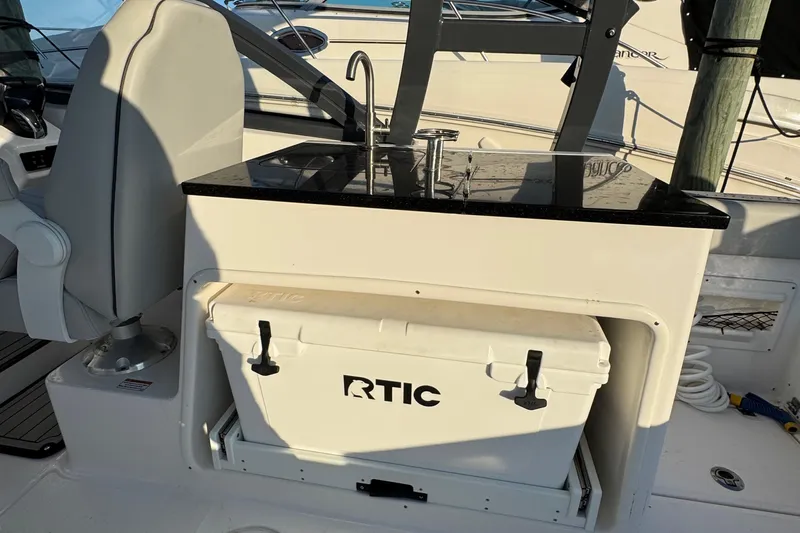  Yacht Photos Pics 2023 Sea Fox 268 Traveler boat interior with RTIC cooler and sink station.