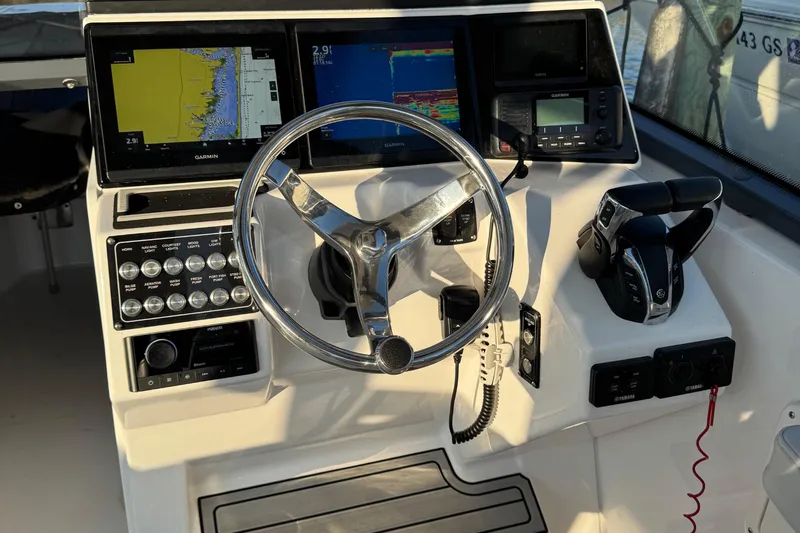  Yacht Photos Pics 2023 Sea Fox 268 Traveler helm with Garmin displays and controls.