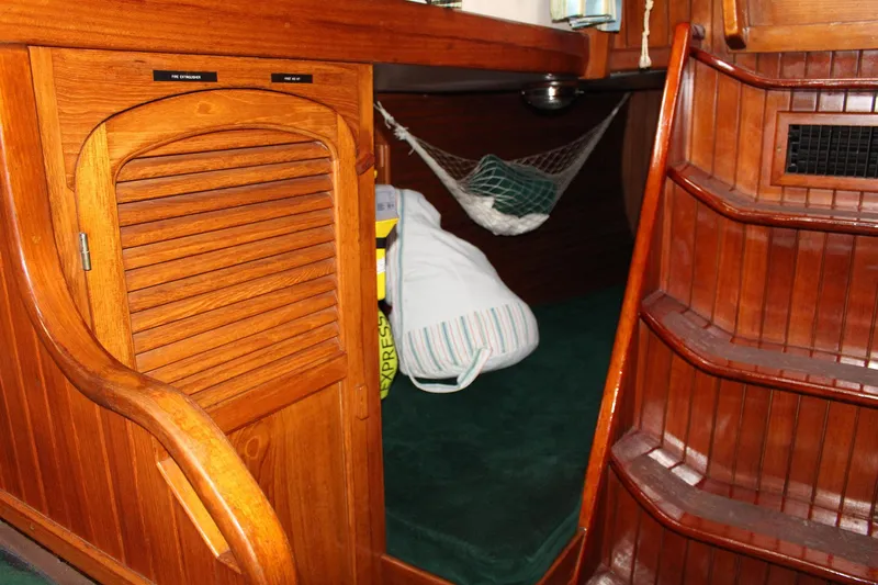 Divine Miss Em Yacht Photos Pics Interior of 1990 Slocum 43 sailboat with wooden cabinetry and steps.
