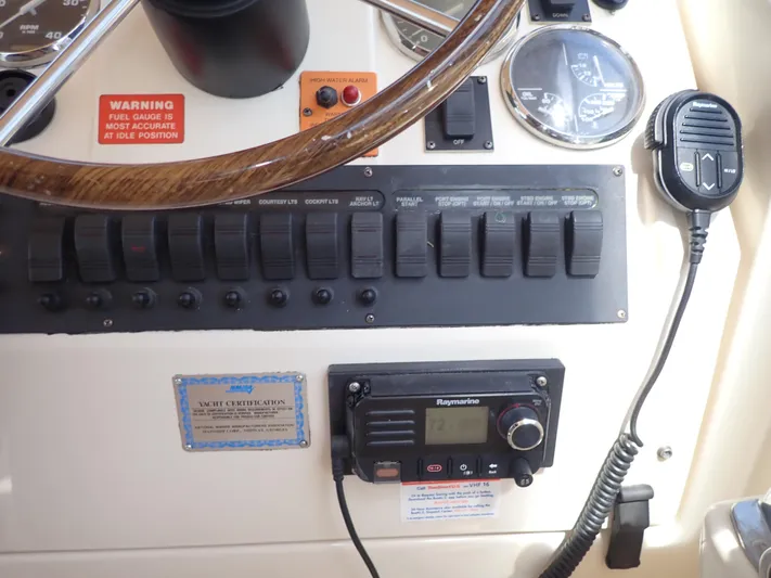  Yacht Photos Pics Control panel of 2004 Mainship 34 Rum Runner II with gauges and communication equipment.