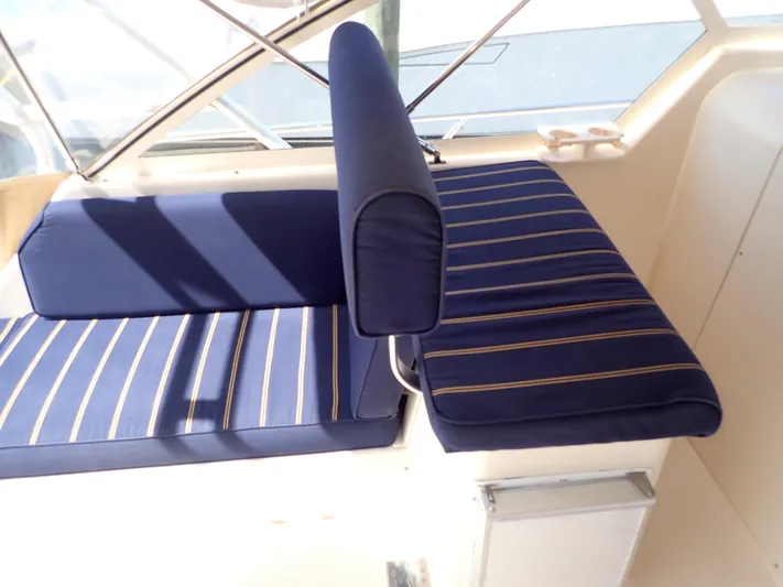  Yacht Photos Pics 2004 Mainship 34 Rum Runner II boat interior with blue striped seating.
