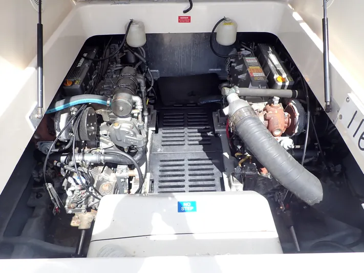  Yacht Photos Pics Engine compartment of 2004 Mainship 34 Rum Runner II boat, showcasing dual engines.