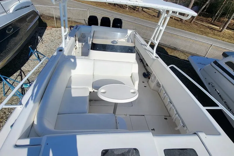  Yacht Photos Pics 2007 Intrepid 370 Cuddy boat interior with white seating and table.