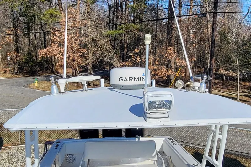  Yacht Photos Pics 2007 Intrepid 370 Cuddy boat with Garmin equipment, surrounded by trees.