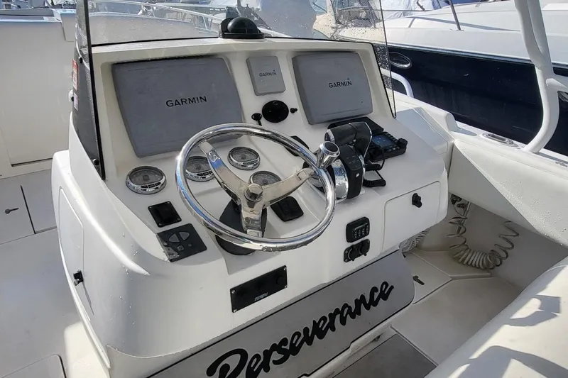  Yacht Photos Pics 2007 Intrepid 370 Cuddy helm with Garmin displays and steering wheel.