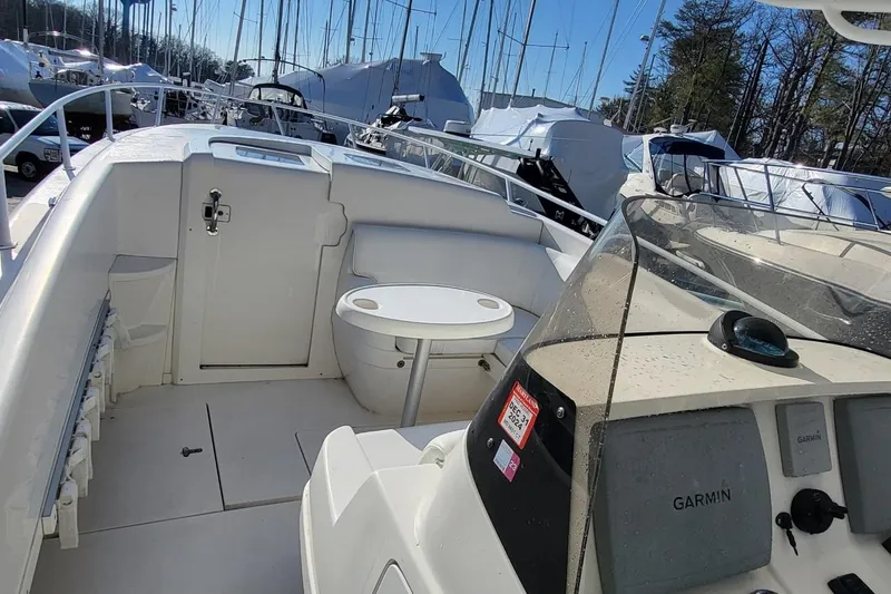  Yacht Photos Pics 2007 Intrepid 370 Cuddy boat interior with seating and Garmin navigation system.