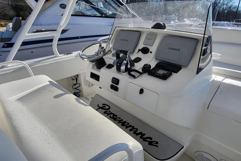  Yacht Photos Pics 2007 Intrepid 370 Cuddy boat cockpit with Garmin navigation system and steering wheel.