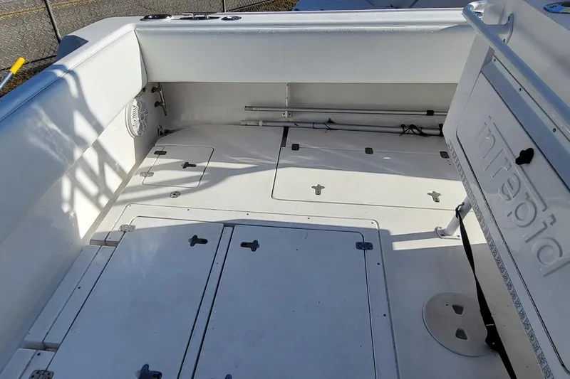  Yacht Photos Pics 2007 Intrepid 370 Cuddy boat deck with storage compartments and seating area.