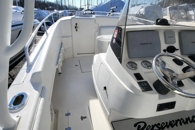  Yacht Photos Pics 2007 Intrepid 370 Cuddy boat interior with Garmin navigation system and steering wheel.