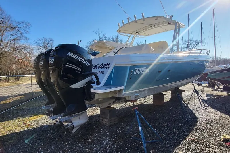  Yacht Photos Pics 2007 Intrepid 370 Cuddy boat with triple Mercury engines on stands.