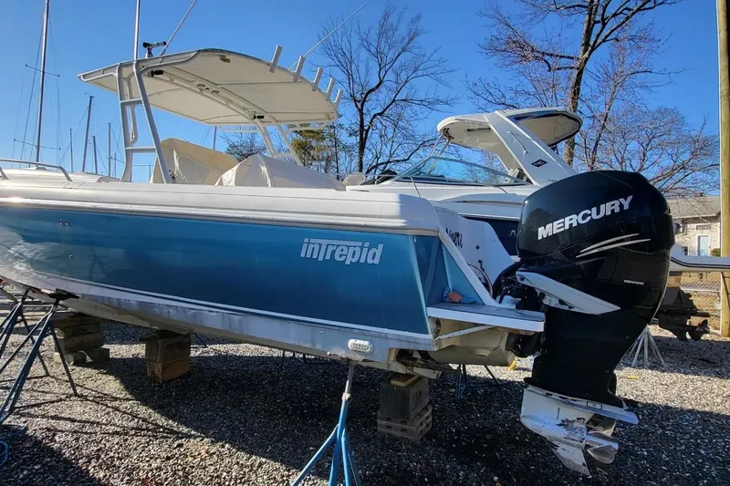  Yacht Photos Pics 2007 Intrepid 370 Cuddy boat with Mercury outboard engine on dry dock.